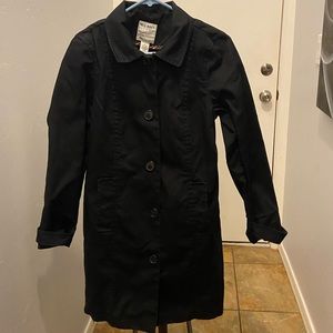 Woman’s black Old Navy trench coat.